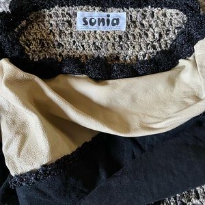 Woman’s hand knit multicolored black/beige sweater